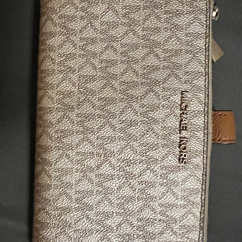 Gold Michael Kors wallet.